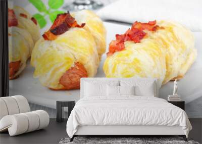 Puff pastry snacks with sausage and bacon. Wall mural