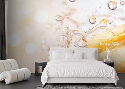  A close-up of oranges in a glass, submerged in water with droplets on the surface Wall mural