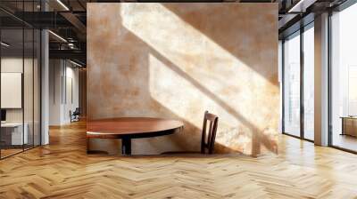  A corner of the room holds a table with two chairs, illuminated by light filtering through a window on the wall Wall mural