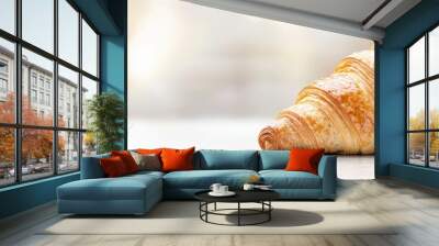  A crisp close-up of a croissant on a table, backdrop softly blurred, croissant gently soft-focused Wall mural