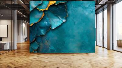  A detailed shot of a blue-green wallpaper featuring gold leaf accents at its base Wall mural