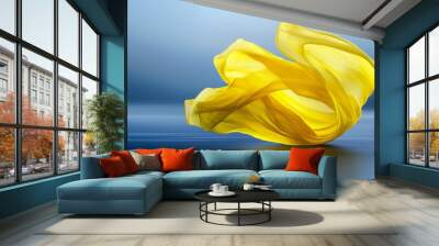  A large, yellow object floats atop a body of water against a backdrop of blue and gray Wall mural