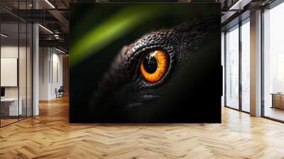  A tight shot of an animal eye, green foliage in the foreground, black backdrop Wall mural