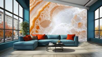  A tight shot of an orange-white material on a pristine white backdrop, featuring a distinct yellow line running through its center Wall mural