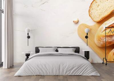  Two loaves of bread atop a wooden cutting board A single loaf nearby Wall mural