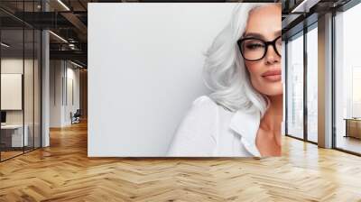 A woman with white hair wearing glasses Wall mural