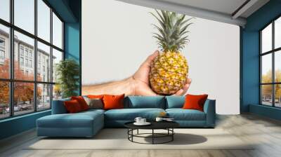 pineapple in hands Wall mural