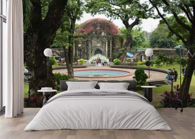 Saint Pancratius Chapel facade and water fountain at Paco park in Manila, Philippines Wall mural