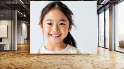 Portrait of a young, happy Asian girl with a bright smile. Concepts. childhood, innocence, happiness, joy, diversity, beauty, youth. Wall mural