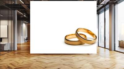 Two gold wedding rings symbolizing love and commitment. Wall mural