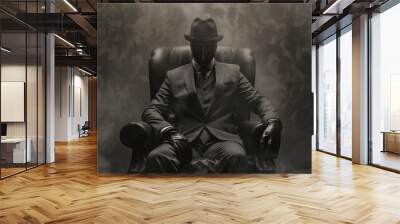 A man in a black suit and hat sits in a chair with a fake mask on his face. The chair is covered in smoke, giving the scene a dark and mysterious atmosphere Wall mural