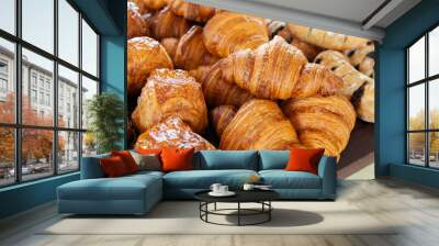 Assortment of delicious and buttery croissants made by pastry chef. All look very tasty and delightful. Natural light. Wall mural