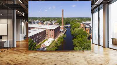 Historic Francis Cabot Lowell Mill building at Charles River and Waltham historic city center aerial view in city of Waltham, Massachusetts MA, USA.  Wall mural