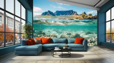 A beautiful blue ocean with a mountain range in the background Wall mural