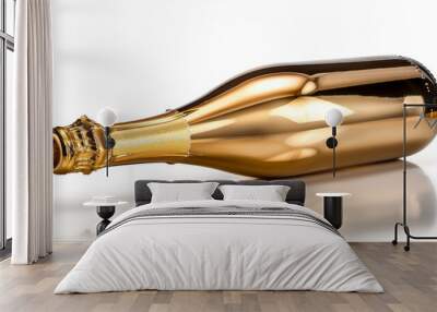 A bottle of gold champagne lying on its side on a white background. Wall mural