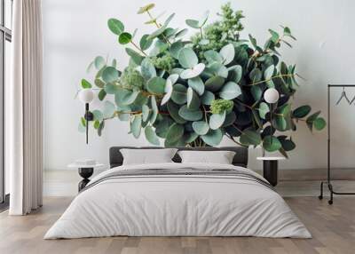 A serene image showcases a lush bouquet of fresh eucalyptus leaves artfully arranged against a pure white background, exuding a sense of calm tranquility. Wall mural