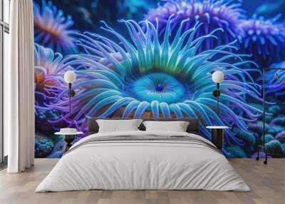 Vibrant blue sea anemone sways gently amidst inky tendrils of turquoise and purple, evoking an enchanting underwater world of mesmerizing beauty. Wall mural