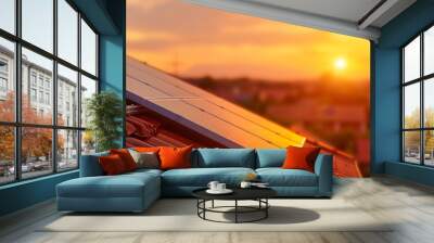 A photovoltaic panel on the roof of an apartment house, sunset in background Wall mural