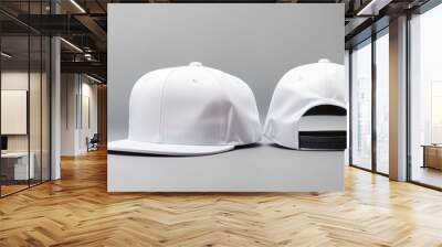 a white baseball cap, with a flat brim and a black back. Wall mural