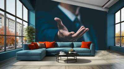 A male hand in a suit shows a palm-up gesture against a gray background, symbolizing concepts of request, bankruptcy, and close-up. Wall mural