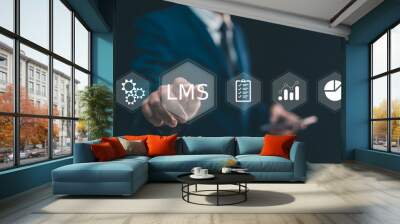 LMS, Learning management system concept. Man hand touching virtual screen to LMS - Learning Management System web icon for lesson and online education, course, application, study, e learning. Wall mural