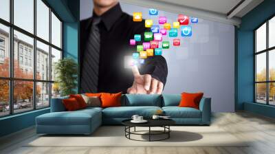 Businessman touching social network icon Wall mural