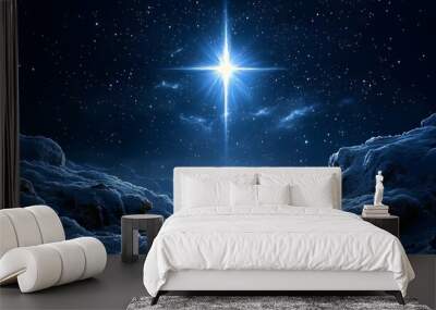 Christmas star shining bright in a winter night sky over a peaceful snow-covered landscape Wall mural