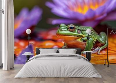 A close up shot of a vibrant green frog resting on a colorful purple and orange lily pad surrounded by the serene reflection of the water in a tranquil pond Wall mural