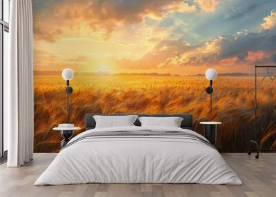 Captivating scenic view of a vast golden wheat field bathed in the warm glowing light of a breathtaking sunset over the serene rolling countryside Wall mural