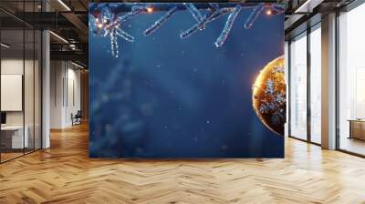 Festive golden Christmas ornament ball hanging amidst sparkling icy branches against a snowy blue background creating a cozy and elegant winter holiday mood and atmosphere Wall mural