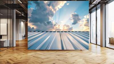 A metal sheet roof stands against a backdrop of blue sky adorned with fluffy white clouds. Wall mural