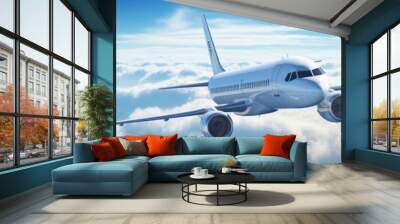 A passenger plane flying above the clouds on a clear day. Wall mural