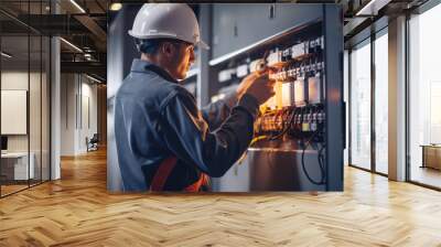 A professional electrician repairing electrical panels and demonstrating their skill in an industrial electrical work environment. Wall mural