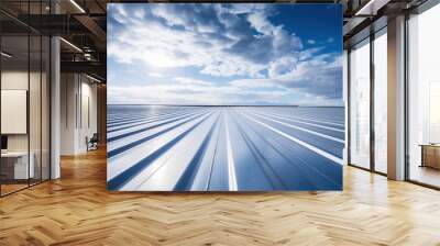 a Roof metal sheet with a blue sky with clouds. Wall mural