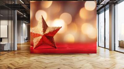 Gold christmas stars with christmas glowing golden red on a red blurred bokeh background. Wall mural