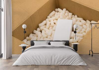 Cardboard box with styrofoam filler for safe packaging. Gift package Wall mural