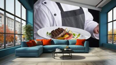 chef in uniform serves a dish in a plate Wall mural