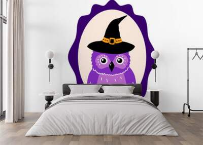 Portrait of an owl wearing a Halloween black hat. Wall mural