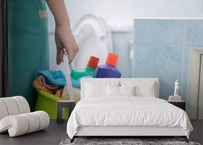 Aisian lady cleaning with a bucket and cleaning products on blurred background. - Image Wall mural