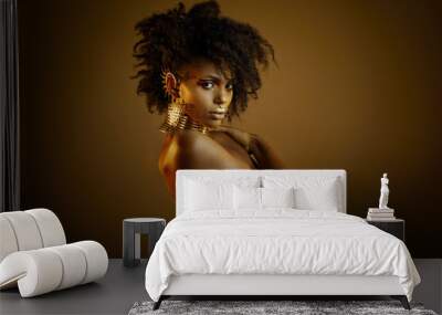 Colorful portrait of a beautiful afro girl wearing gold jewelry Wall mural