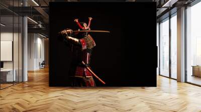 Portrait of a samurai in armor in attack position Wall mural