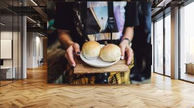 Woman Holding two bread in coffee shop  Wall mural