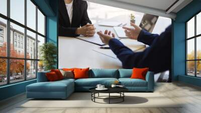 Two businessmen discussing and exchanging ideas in the office. Wall mural