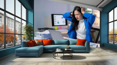 A woman in a blue jacket is screaming at her computer Wall mural