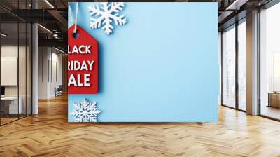 Bright and eye-catching Black Friday sale tag with white snowflakes on a blue background, perfect for holiday promotions. Wall mural