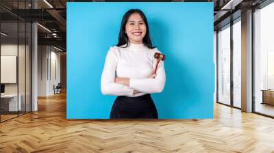 Women are doing various poses on a blue background. Wall mural