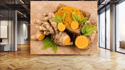 Curcuma aromatica or wild turmeric rhizome on an old background. Wall mural