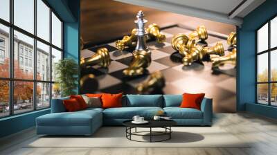 Silver chess king standing among golden falling chess pieces, business competition has winners and losers, strategy will make company successful, investment and management concept. Wall mural