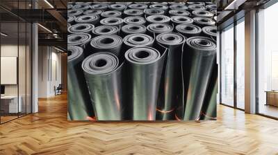 warehouse rolls of rubber. black rolls. Wall mural