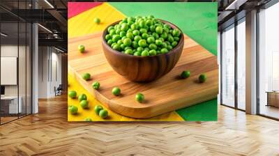 bowl and wooden board with fresh green peas on colorful background: ideal for food photography, cook Wall mural